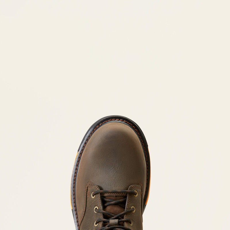 A top down view of a brown boot toe with a white background, 