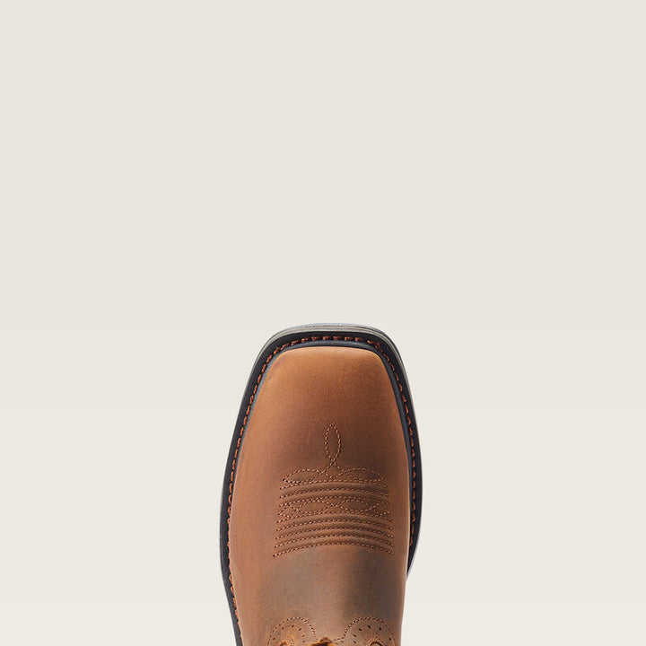 Brown leather boot sole on a beige background