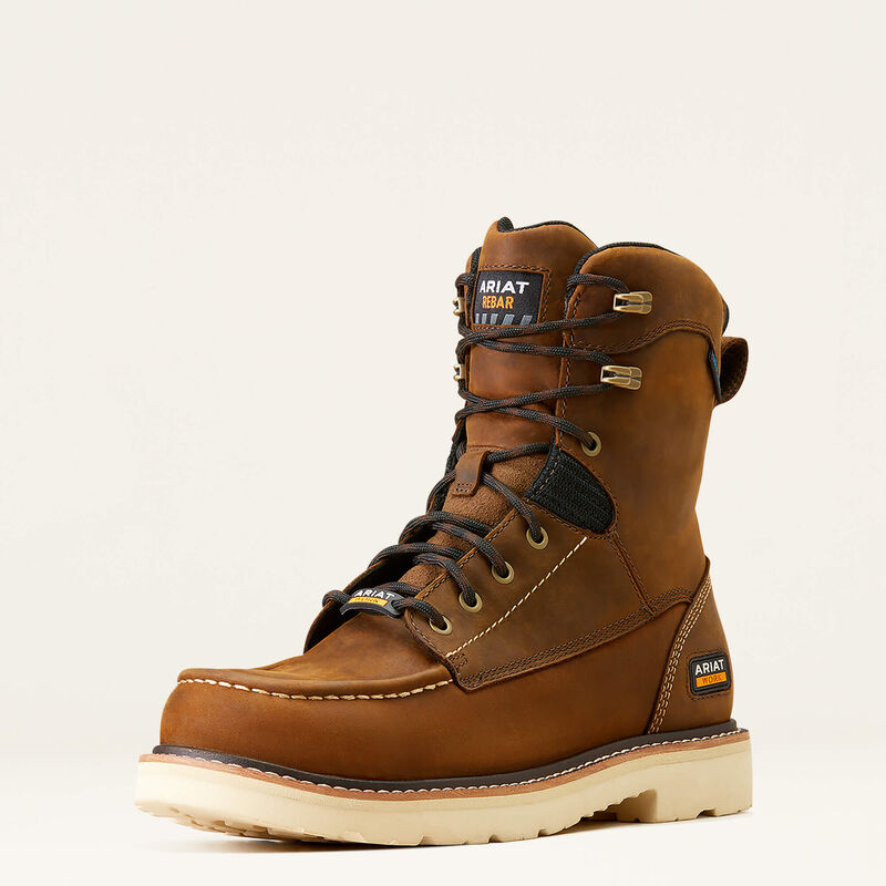 Brown work boot with Ariat branding on a beige background