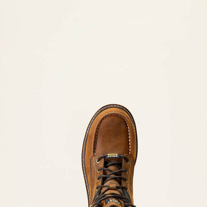 Brown leather boot on a beige background