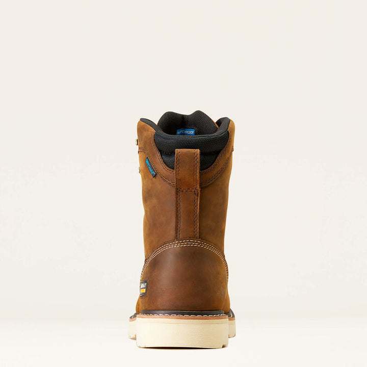 Brown leather boot with a white sole on a beige background