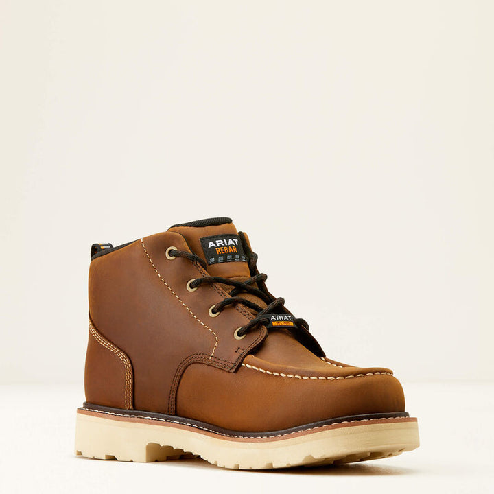 A tan boot with a white background.