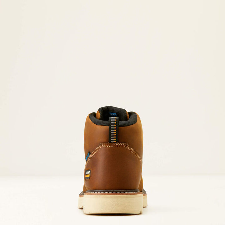 The back view of a tan boot with a white background. 