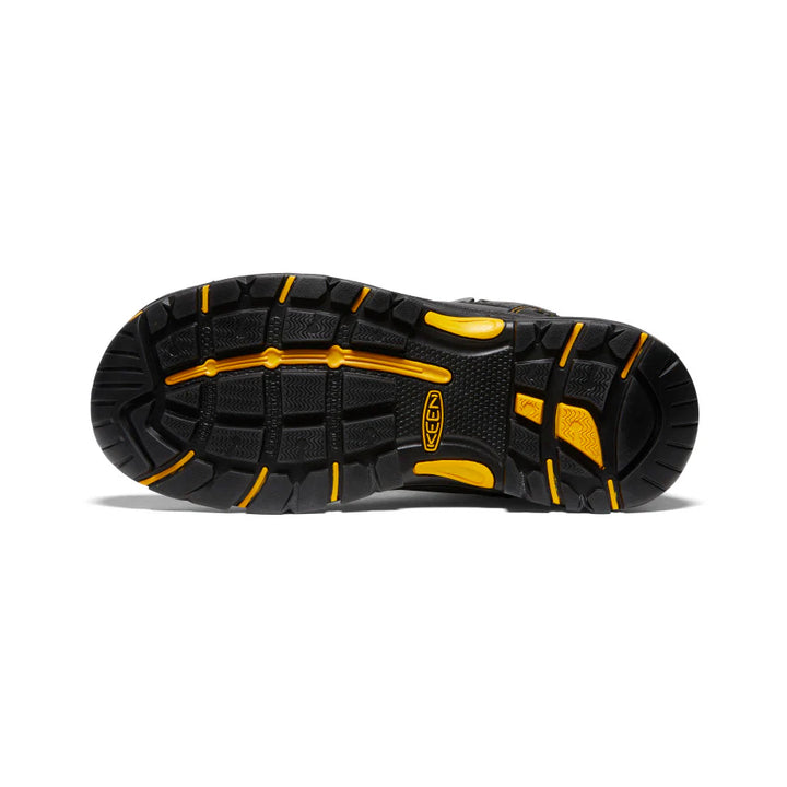Black and yellow hiking shoe sole on a white background