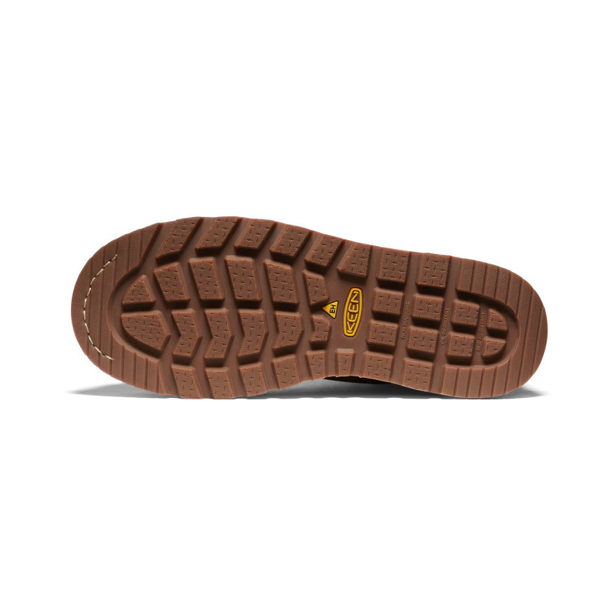 Brown sole of a shoe with a brand logo on a white background