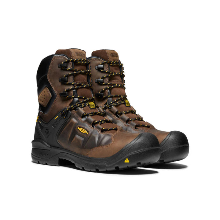 Pair of brown hiking boots with black soles on a white background