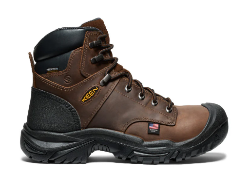 Brown work boot with black sole on a white background