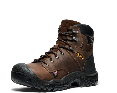 Brown work boot with black sole on a white background