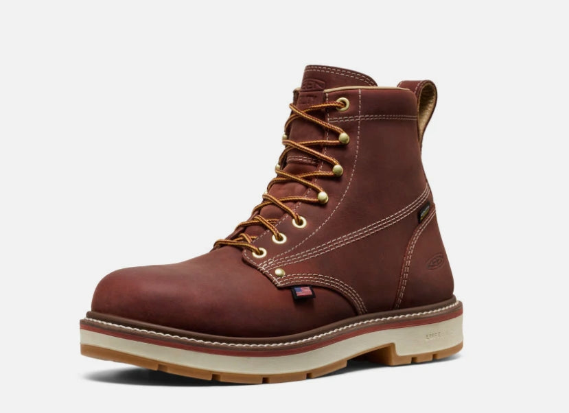 Brown leather boot with gold laces on a white background