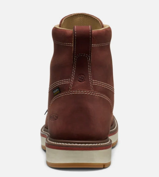 The back of a brown boot on a white background.