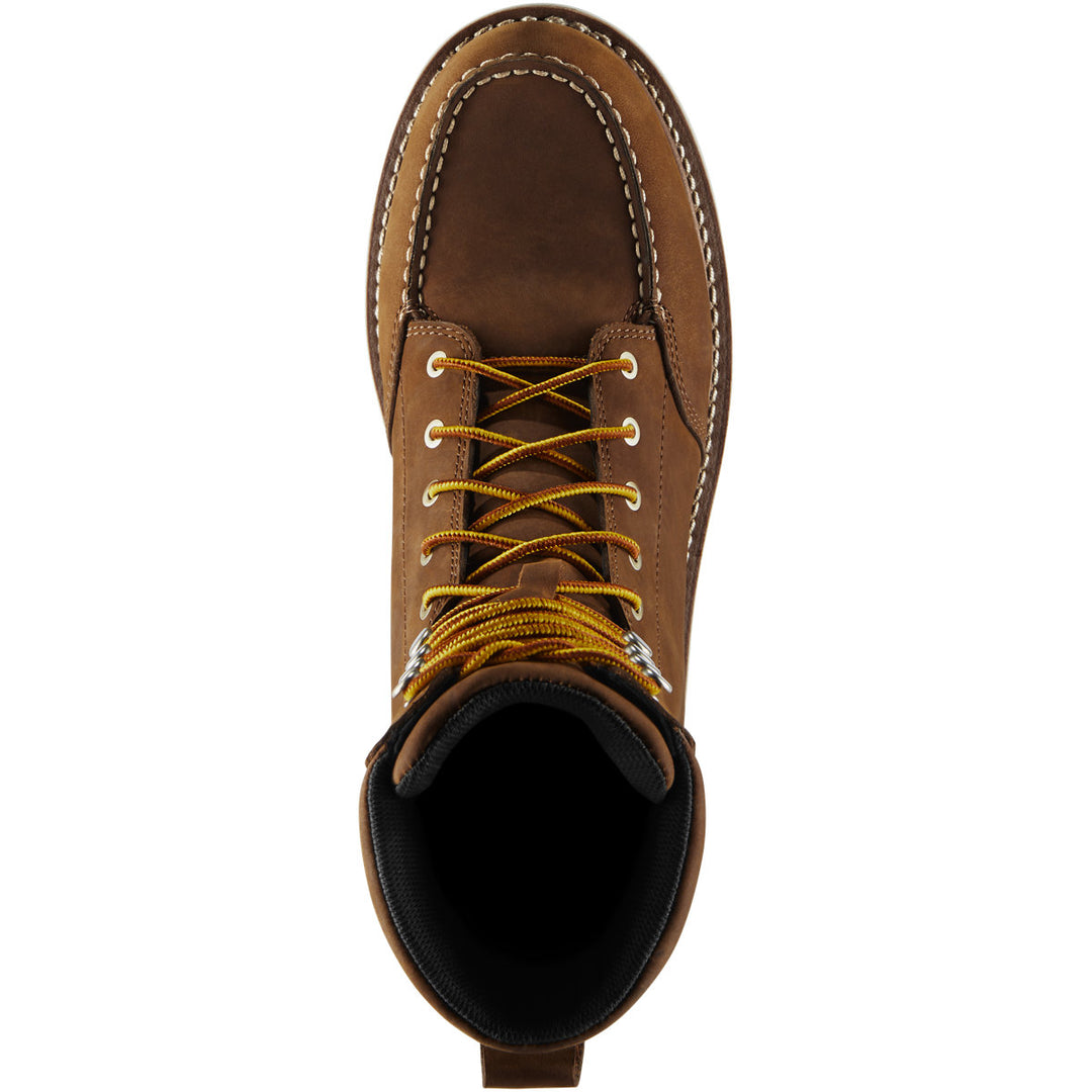 A top down view of a brown boot with yellow laces. 