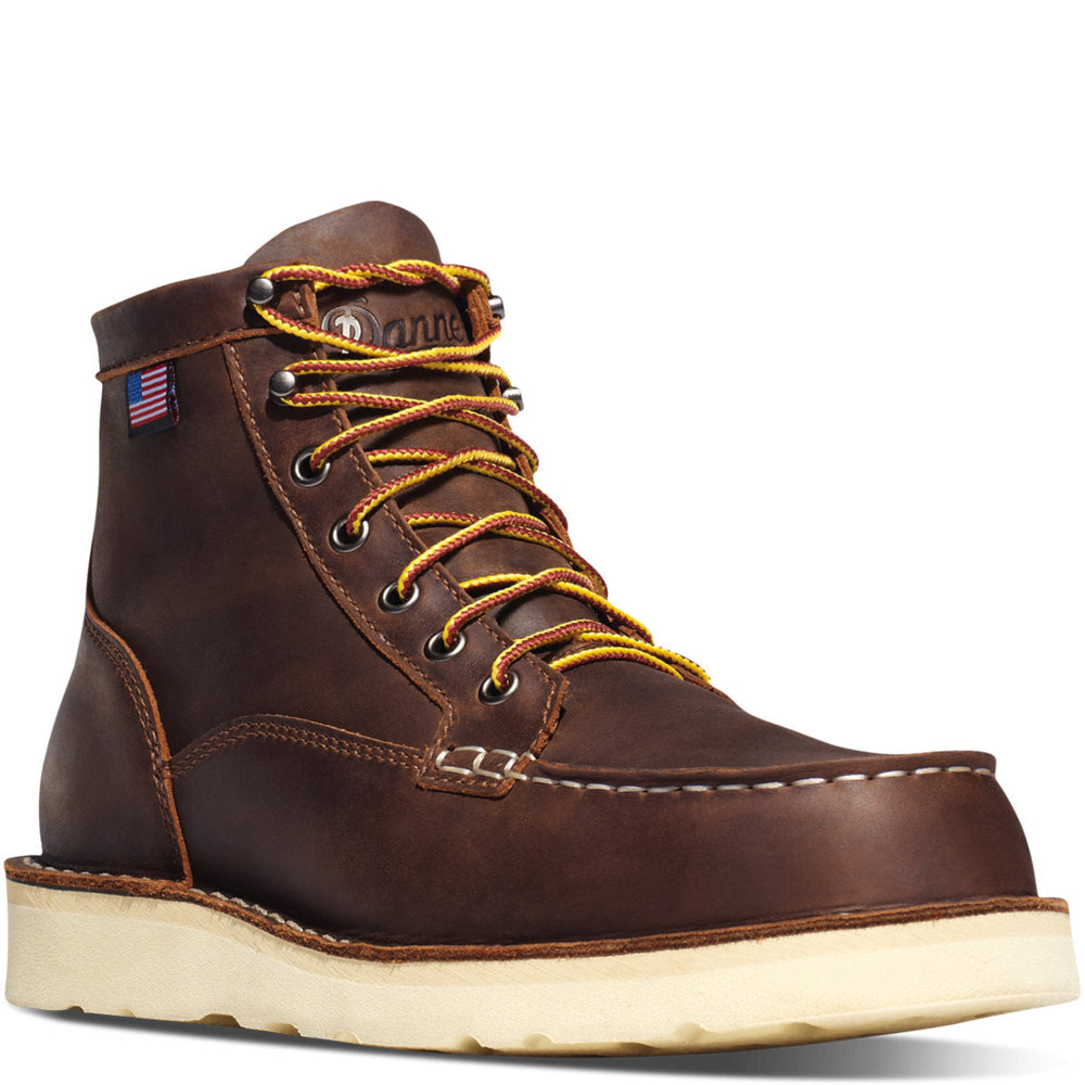 A brown full-grain leather men's boot with a steel toe, lace-up closure, and a Danner Wedge outsole. Features a non-waterproof liner and an American flag on the top.