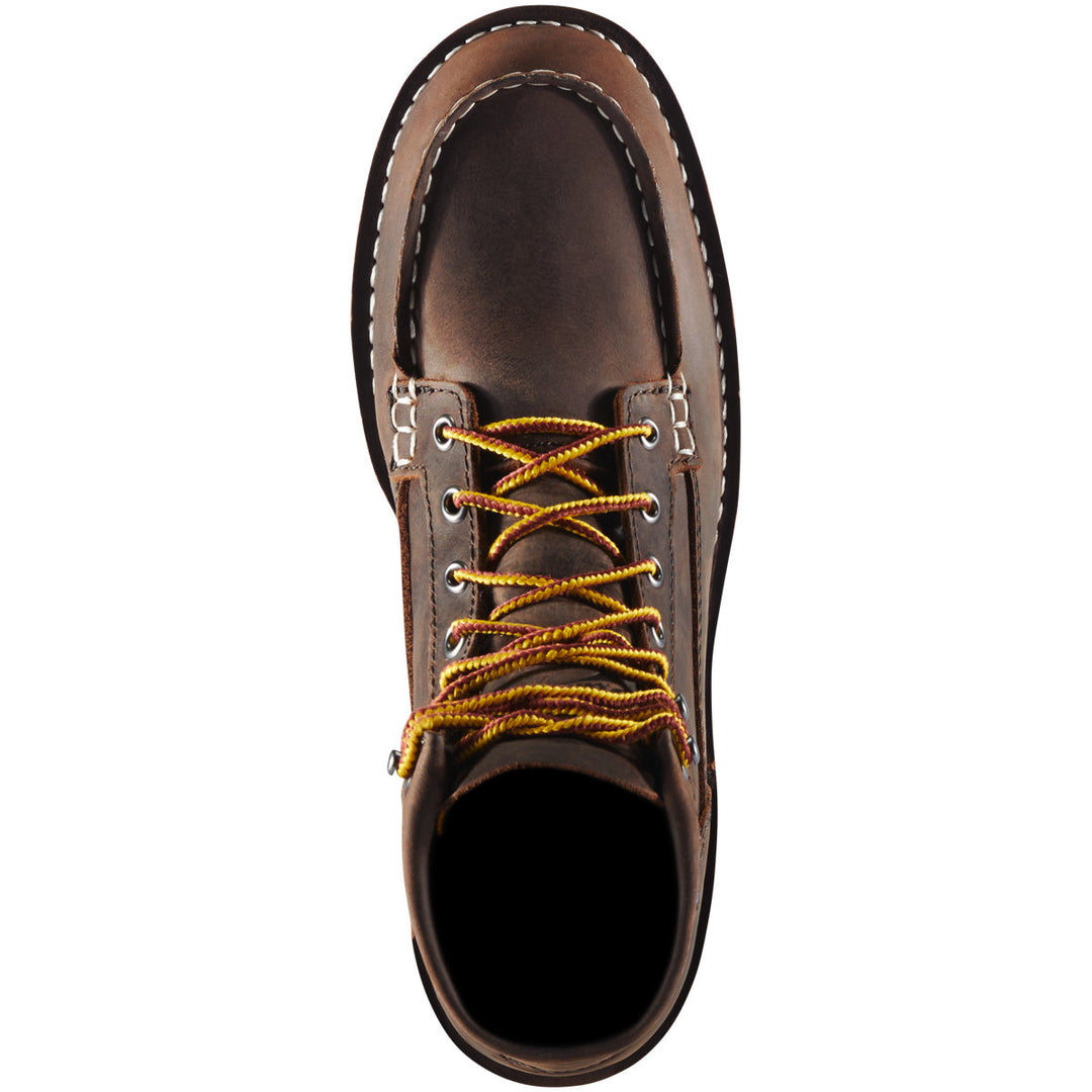 The top view of a brown boot with yellow laces with a white background