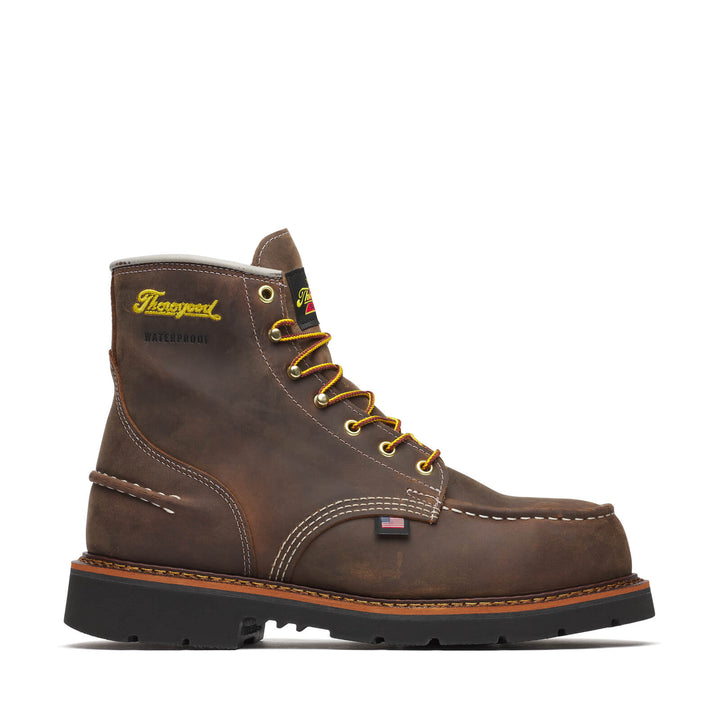 Side angle of a brown boot with yellow/red laces on a white background.