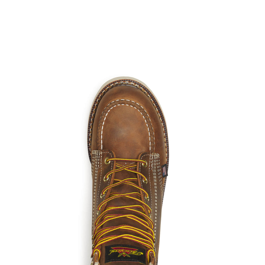 Brown leather boot with yellow laces on a white background