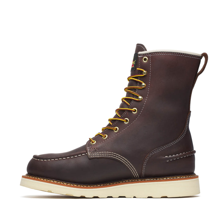 Brown leather boot with gold laces on a white background