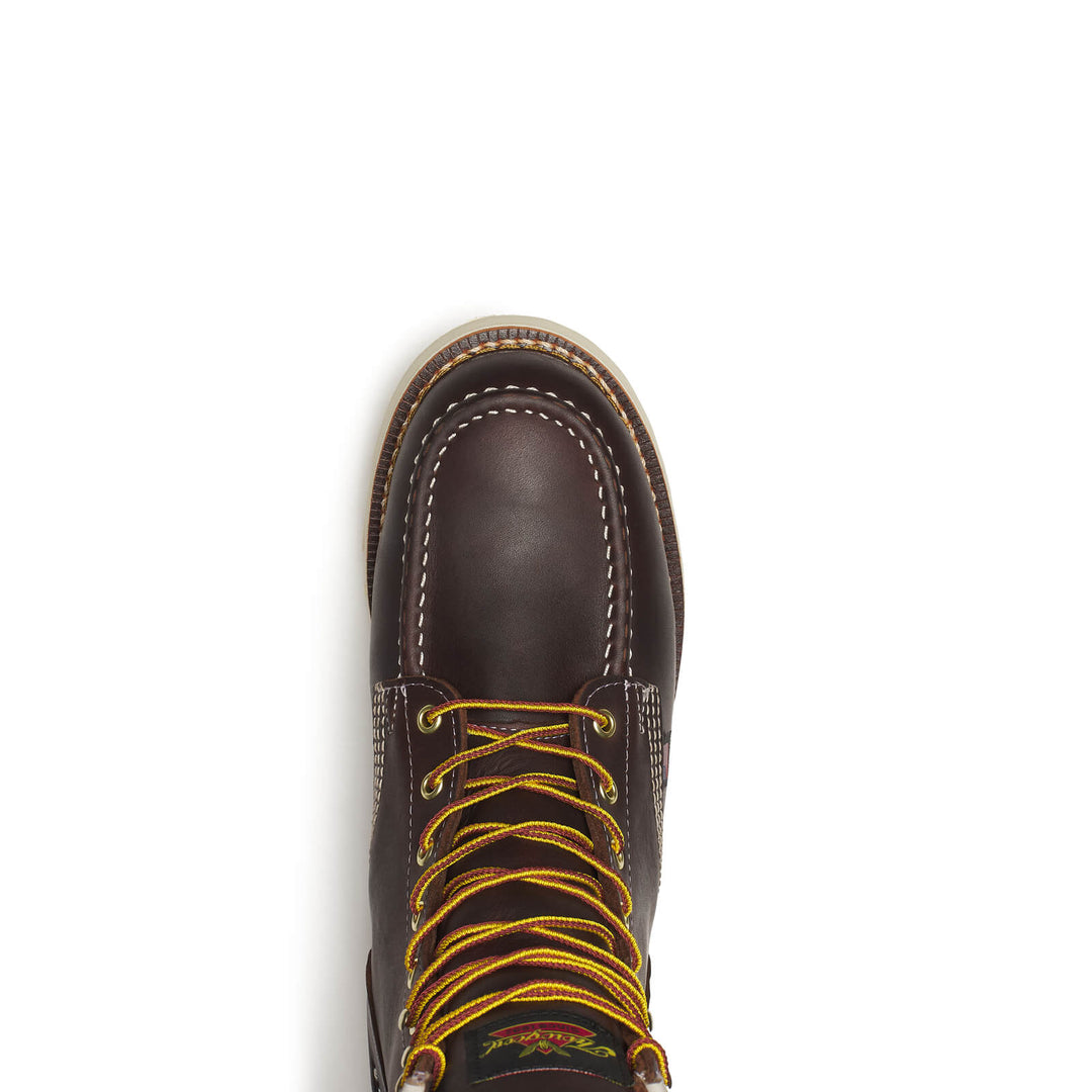 Brown leather boot with yellow laces on a white background