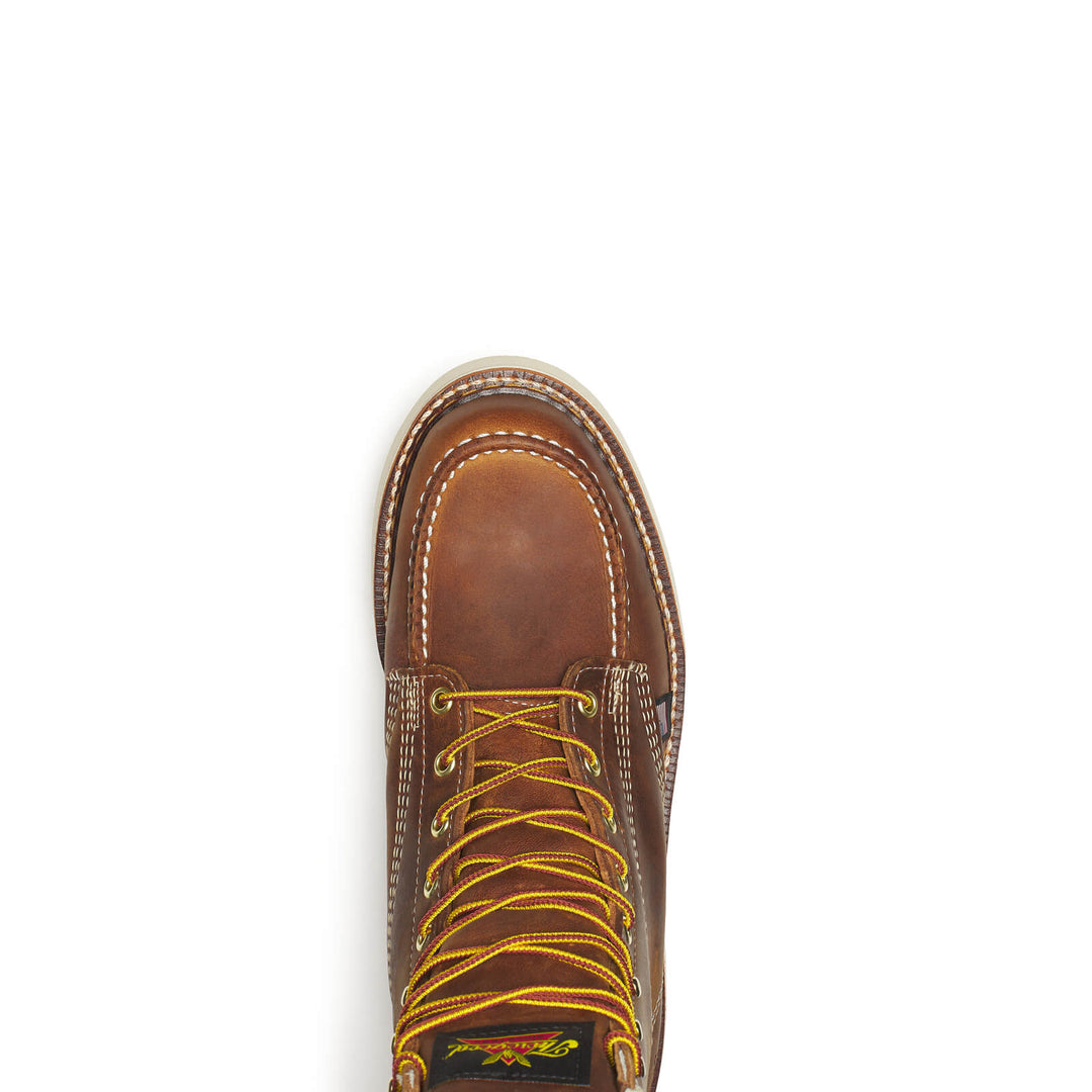 Brown leather boot with yellow laces on a white background