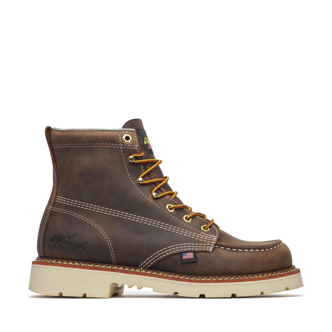 Brown leather boot with yellow laces on a white background