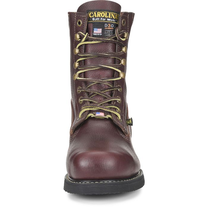 Front view of a brown boot with a white background. 