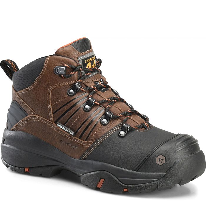 A pair of brown, waterproof boots with a carbon composite fiber toe cap and a metallic D3O internal metatarsal guard, featuring a black and orange accent on the heel.