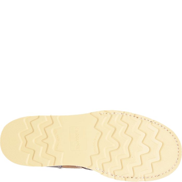 A picture of boot tread with a white background. 