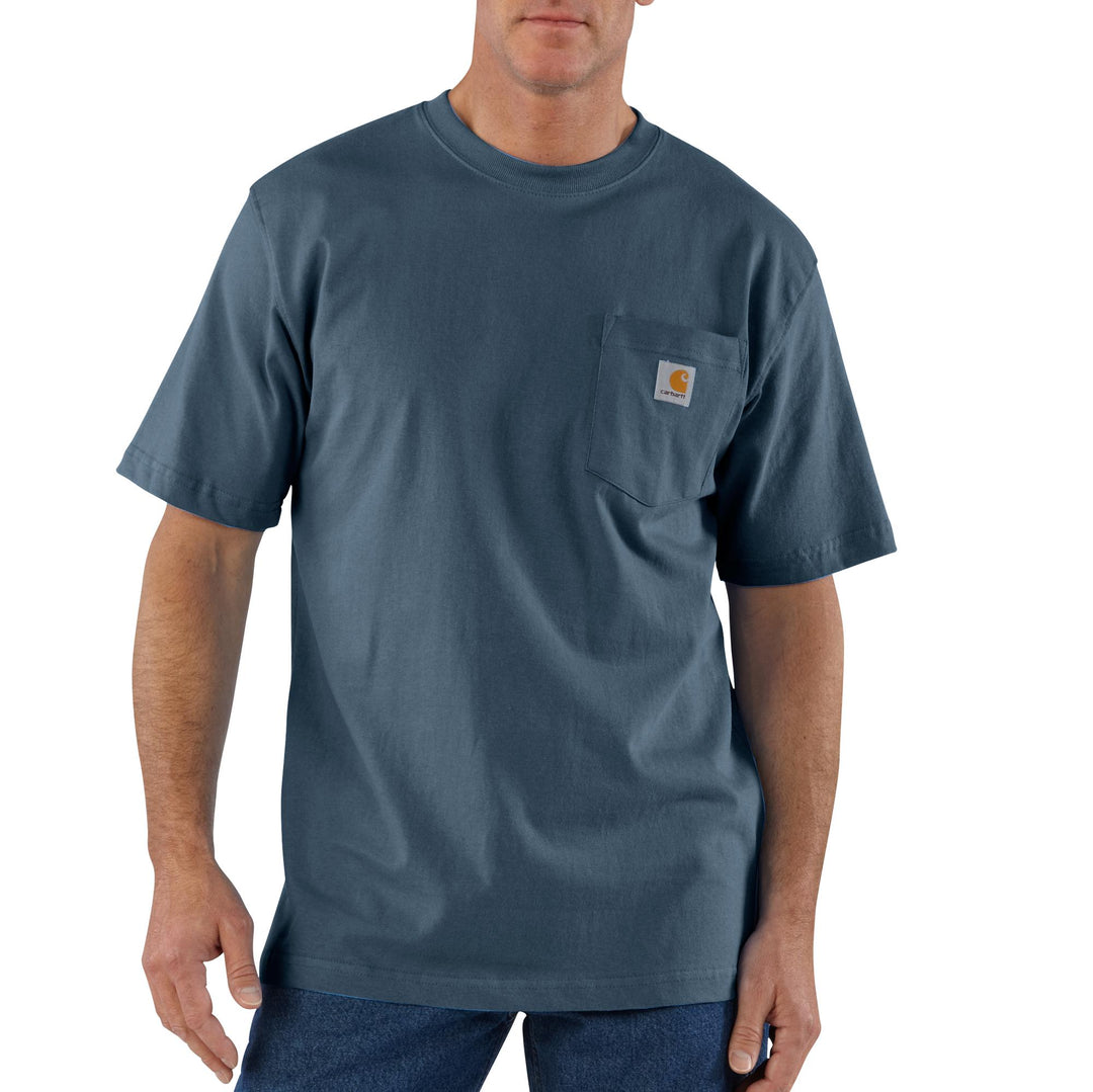 A man wearing a blue short sleeve shirt