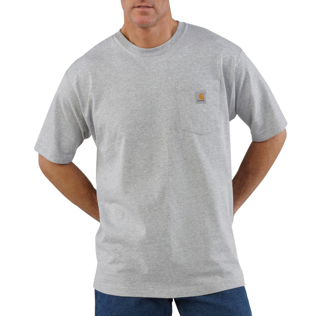A man wearing a light gray short sleeve shirt