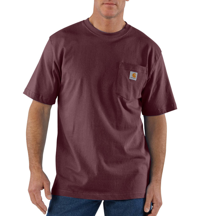 A man wearing a short sleeve maroon shirt