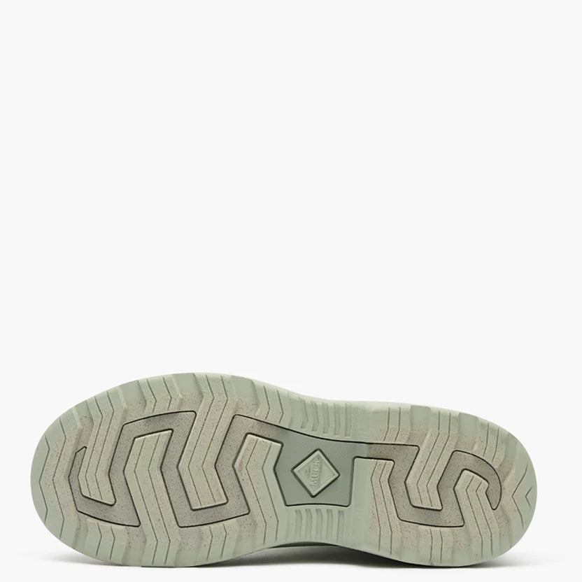 Tread of a light green rubber boot