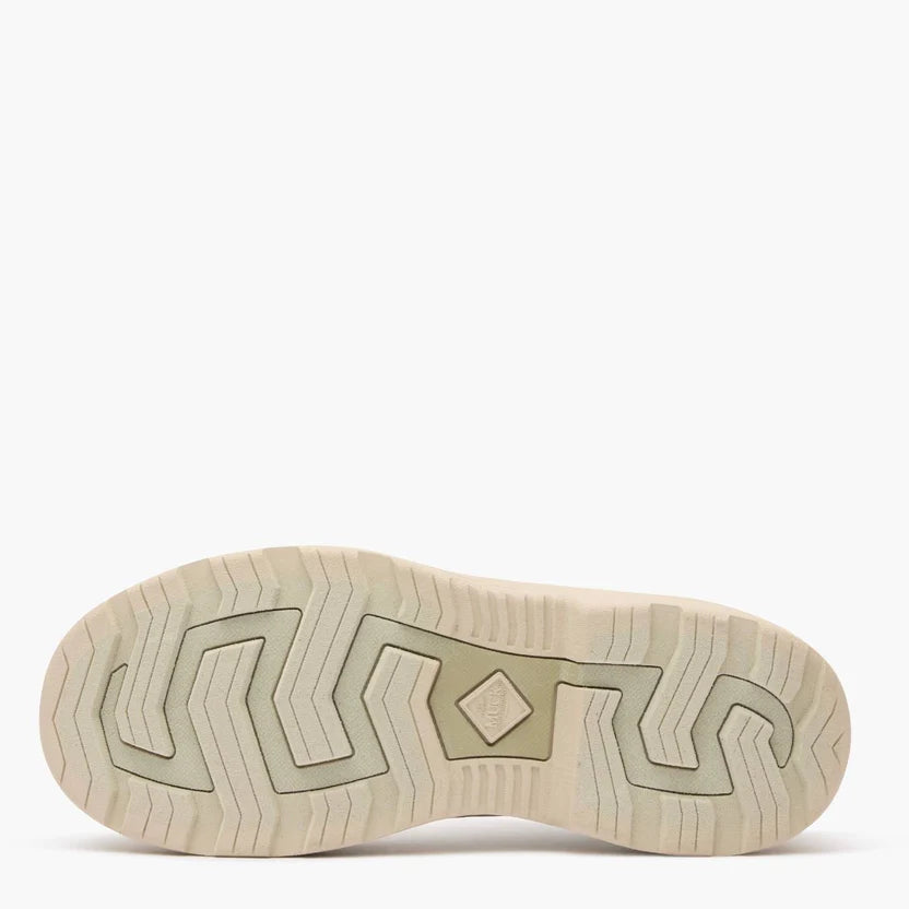 Beige rubber boot tread on a white background