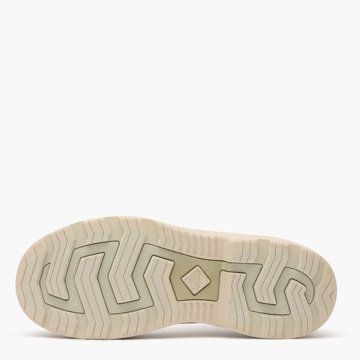 Beige rubber boot tread on a white background