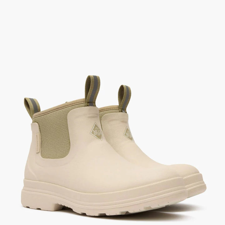 Beige rubber boot with elastic sides on a white background